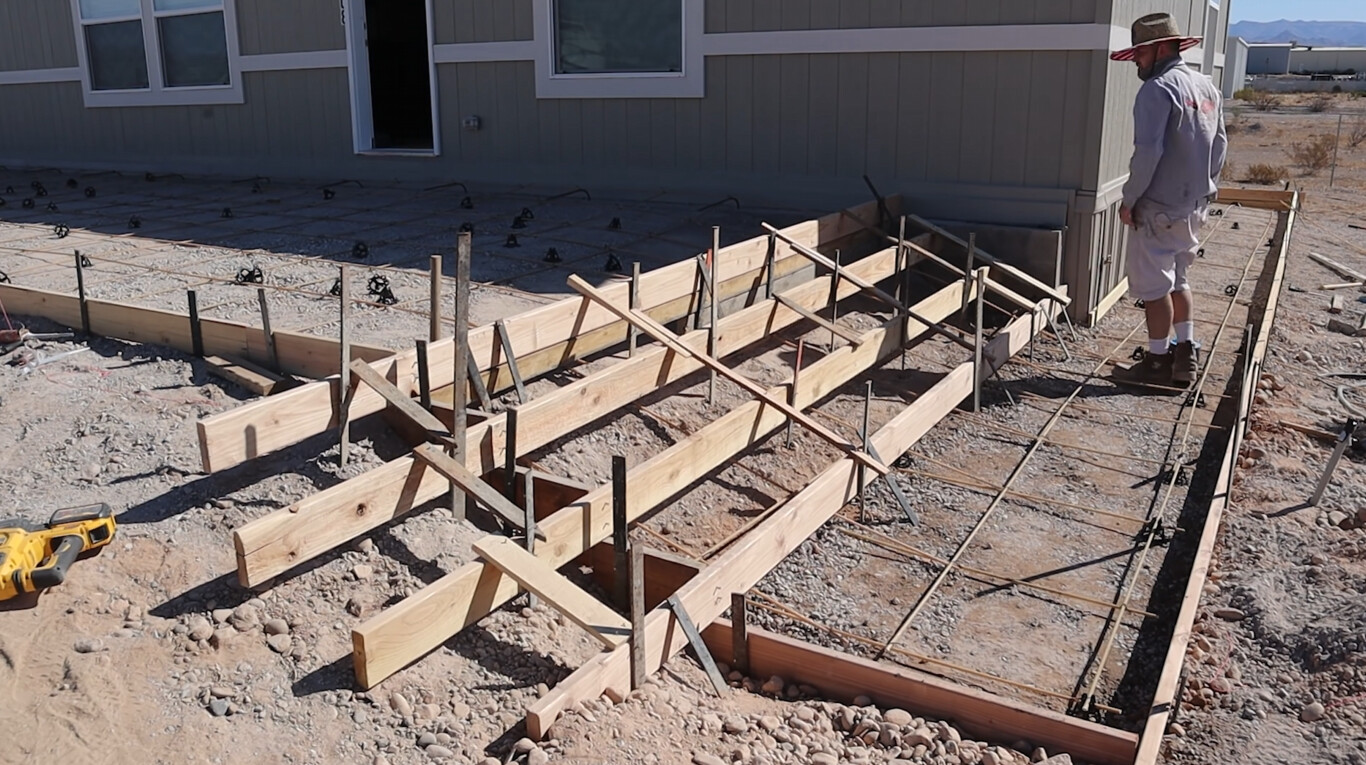 Foundation forms setup for concrete footing installation in residential construction